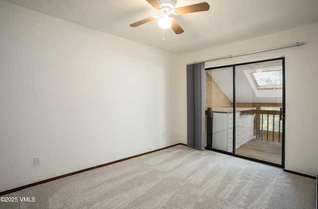 717 Bull Run Unit A, Eagle, CO 81631 - empty room with carpet flooring, a ceiling fan, and a skylight