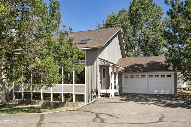 717 Bull Run Unit A, Eagle, CO 81631 - view of front facade with asphalt driveway, a shingled roof, and a garage