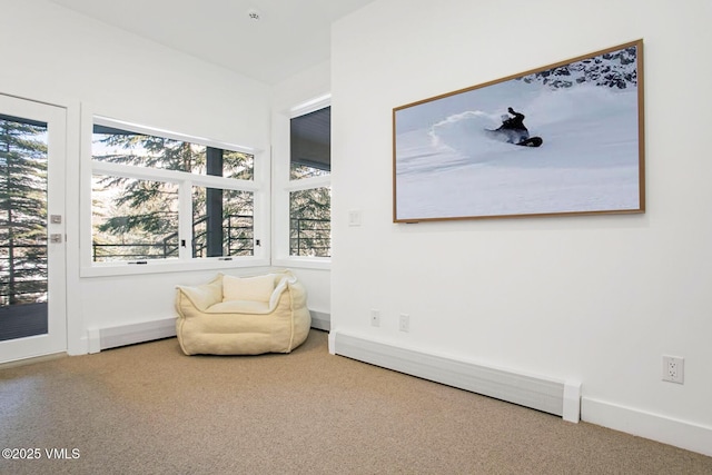 living area featuring carpet floors and a baseboard radiator