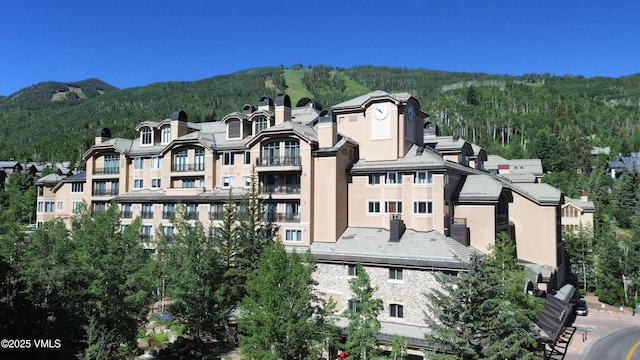 26 Avondale Ln Unit 114-H, Beaver Creek, CO 81620 - view of building exterior with a forest view and a mountain view