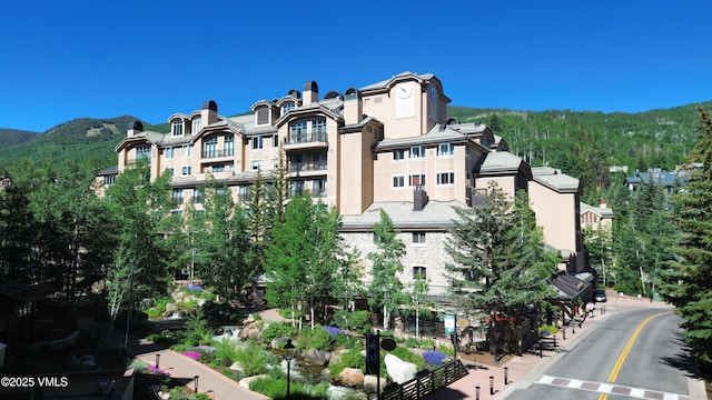 26 Avondale Ln Unit 114-H, Beaver Creek, CO 81620 - view of building exterior featuring a mountain view and a forest view