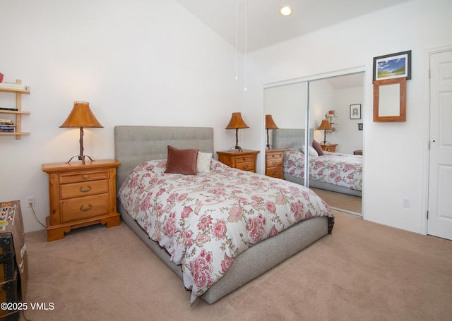 104-2 Quail Cir, Gypsum, CO 81637 - bedroom with light colored carpet, a closet, lofted ceiling, and recessed lighting