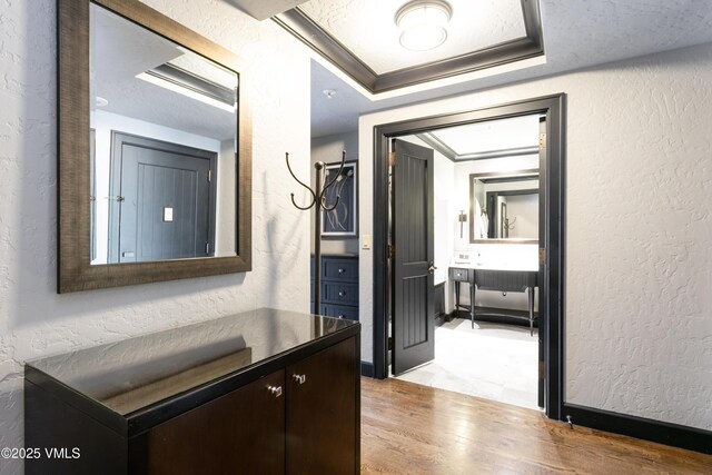 130 Daybreak Rdg Unit 732, Avon, CO 81620 - hallway featuring wood finished floors and a textured wall