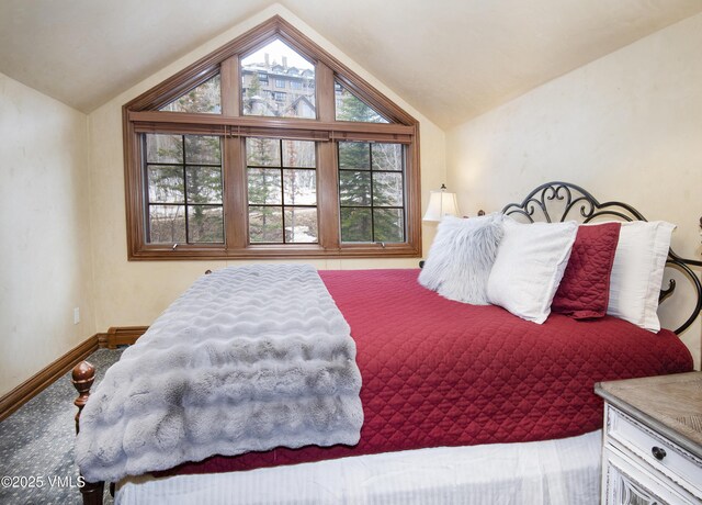1120 Village Rd Unit 7, Beaver Creek, CO 81620 - bedroom with baseboards and vaulted ceiling
