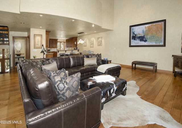 1120 Village Rd Unit 7, Beaver Creek, CO 81620 - living room with wood-type flooring, baseboards, and recessed lighting