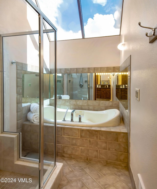 bathroom featuring independent shower and bath and tile patterned floors