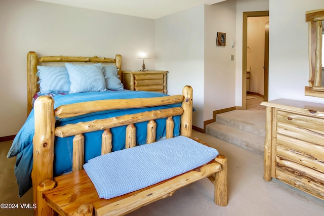 bedroom featuring light colored carpet