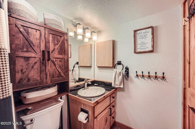 4570 Vail Racquet Club Dr Unit 2-3, Vail, CO 81657 - bathroom with a textured ceiling, vanity, and a textured wall