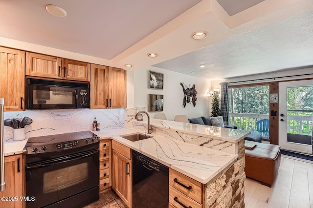 4570 Vail Racquet Club Dr Unit 2-3, Vail, CO 81657 - kitchen featuring black appliances, a peninsula, light stone counters, open floor plan, and decorative backsplash