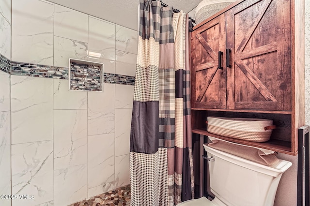 4570 Vail Racquet Club Dr Unit 2-3, Vail, CO 81657 - bathroom featuring tiled shower and toilet