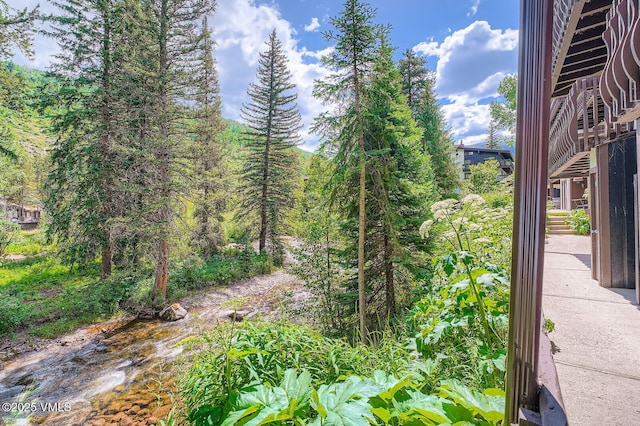 4570 Vail Racquet Club Dr Unit 2-3, Vail, CO 81657 - view of yard featuring stairs and a view of trees