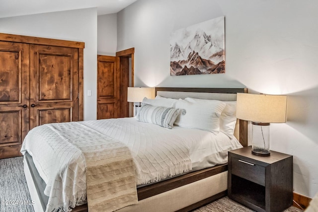 bedroom featuring vaulted ceiling