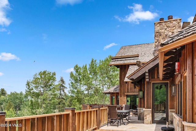 wooden terrace featuring a patio