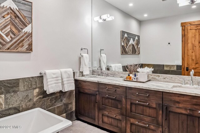 bathroom featuring vanity and a bathtub