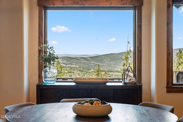 dining area with a mountain view and a wealth of natural light