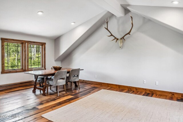 dining area featuring dark hardwood / wood-style flooring and vaulted ceiling with beams