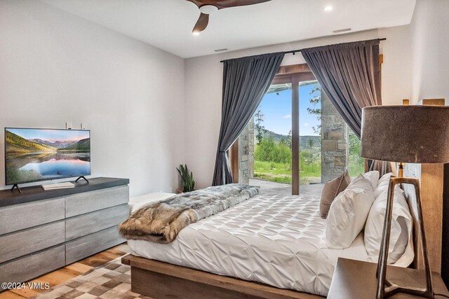 bedroom featuring ceiling fan, access to exterior, and light wood-type flooring