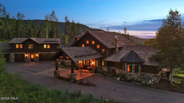 view of front of home with a garage and a mountain view