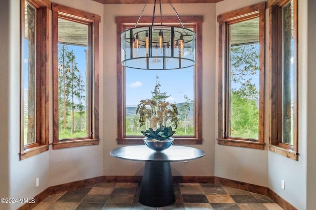 interior space with plenty of natural light and a notable chandelier