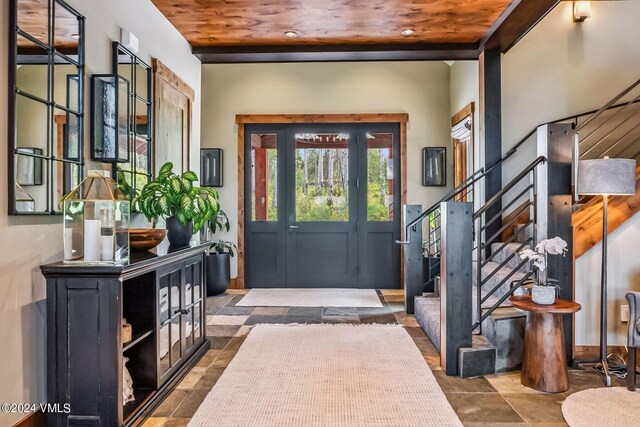 foyer entrance featuring wooden ceiling