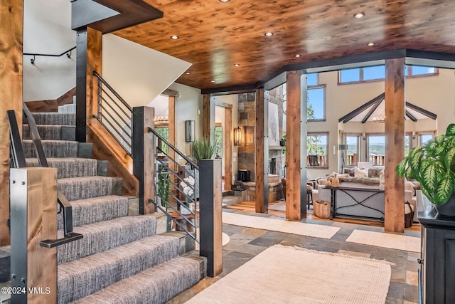 stairway with wood ceiling