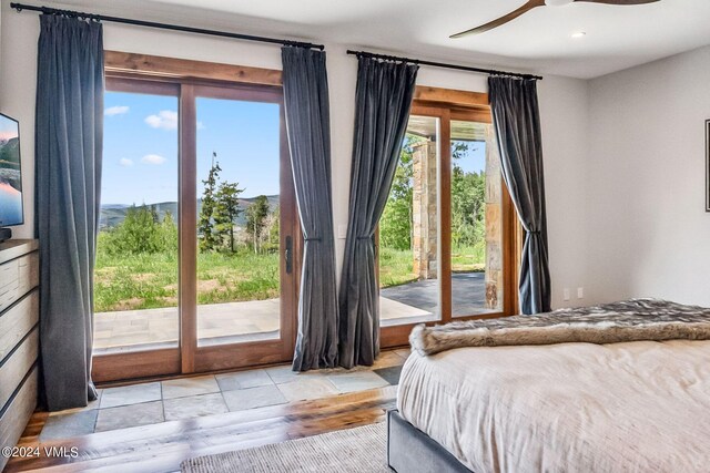 unfurnished bedroom featuring ceiling fan and access to exterior