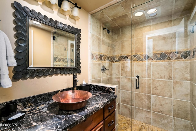 bathroom with vanity and an enclosed shower