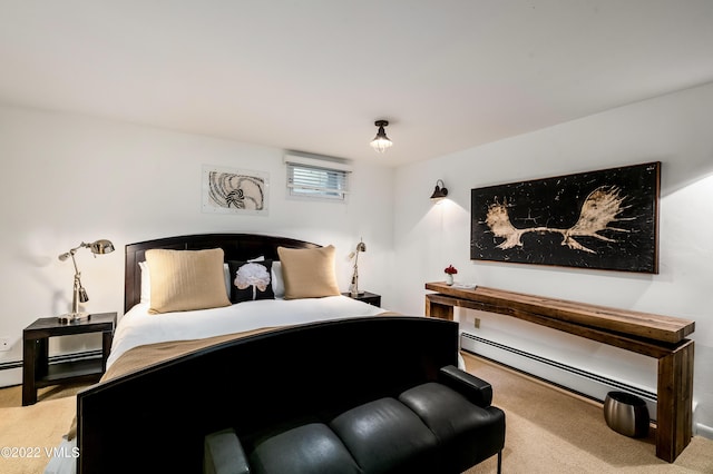 bedroom with a baseboard radiator and light colored carpet