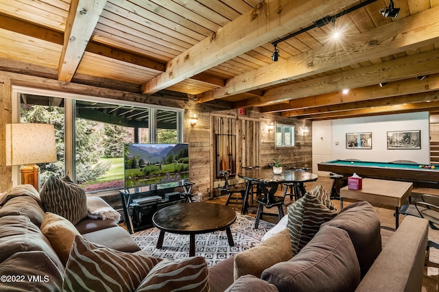 interior space featuring beamed ceiling, track lighting, wooden walls, and billiards