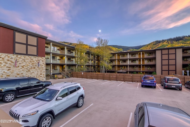 outdoor building at dusk with a mountain view