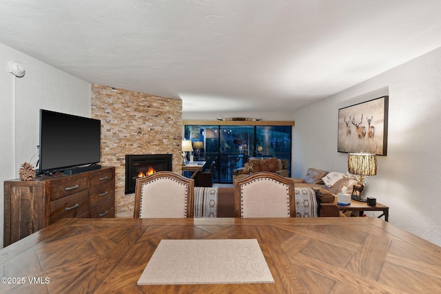 dining area featuring a large fireplace