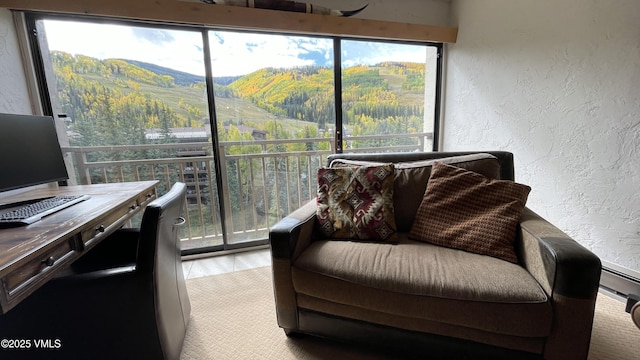 sunroom / solarium with a mountain view