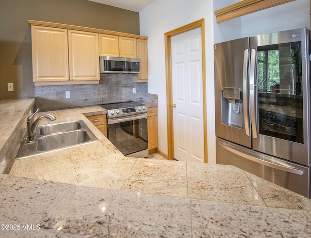 1082 W Wildwood Rd Unit C, Avon, CO 81620 - kitchen with stainless steel appliances, light brown cabinetry, tile countertops, and backsplash