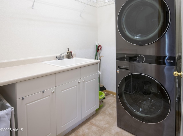 1082 W Wildwood Rd Unit C, Avon, CO 81620 - washroom with stacked washer / dryer, light tile patterned flooring, and cabinet space