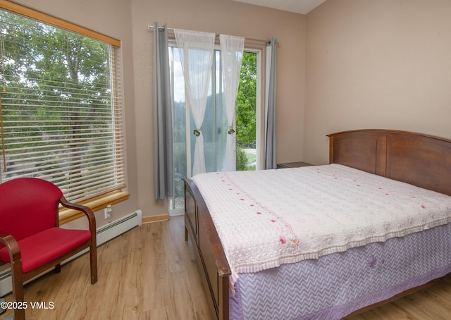 1082 W Wildwood Rd Unit C, Avon, CO 81620 - bedroom with light wood-style floors and access to outside
