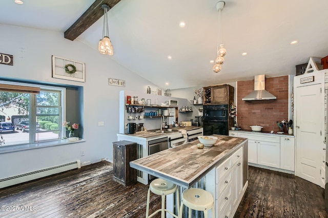 751 Bull Run, Eagle, CO 81631 - kitchen featuring wall chimney exhaust hood, white cabinetry, dark wood finished floors, baseboard heating, and pendant lighting