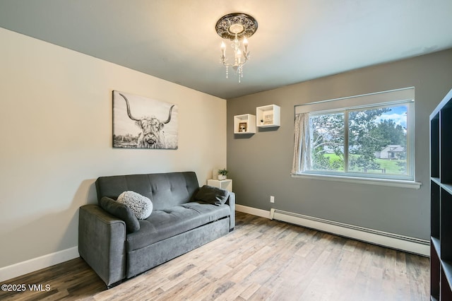 751 Bull Run, Eagle, CO 81631 - living area with a baseboard radiator, a chandelier, and wood finished floors
