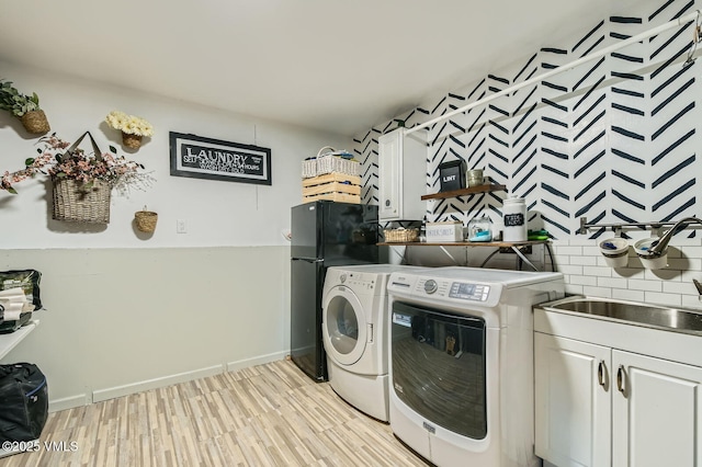 751 Bull Run, Eagle, CO 81631 - washroom with independent washer and dryer, cabinet space, and light wood-type flooring