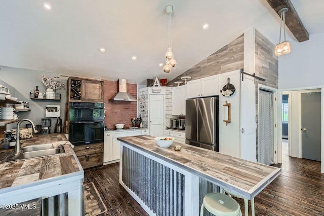 751 Bull Run, Eagle, CO 81631 - kitchen featuring stainless steel appliances, wall chimney exhaust hood, high vaulted ceiling, dark wood-type flooring, and white cabinetry