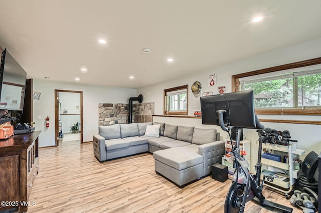 751 Bull Run, Eagle, CO 81631 - living room with a wood stove, light wood-type flooring, and recessed lighting