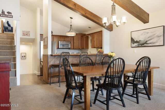 carpeted dining space with vaulted ceiling with beams and a notable chandelier