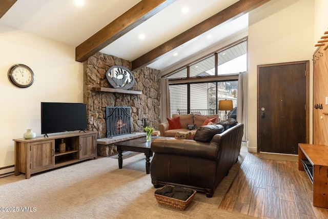 living room featuring a fireplace, lofted ceiling with beams, and light wood-type flooring