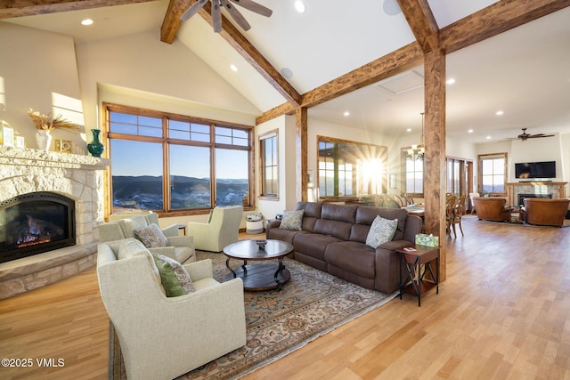 96 Pikes Way, Edwards, CO 81632 - living area featuring a fireplace, ceiling fan, beamed ceiling, wood finished floors, and recessed lighting