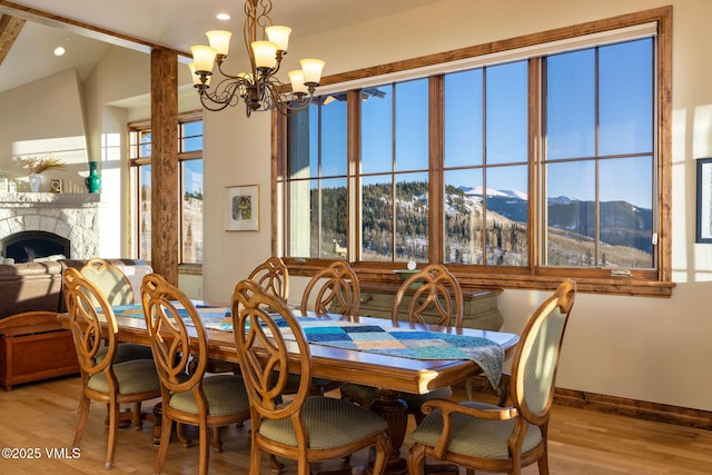 96 Pikes Way, Edwards, CO 81632 - dining room featuring light wood-style floors, a chandelier, recessed lighting, a mountain view, and baseboards