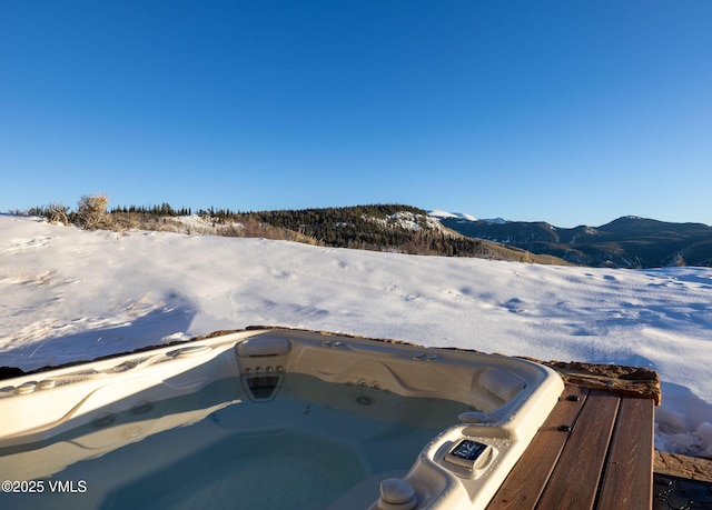96 Pikes Way, Edwards, CO 81632 - snow covered pool featuring a mountain view and a hot tub