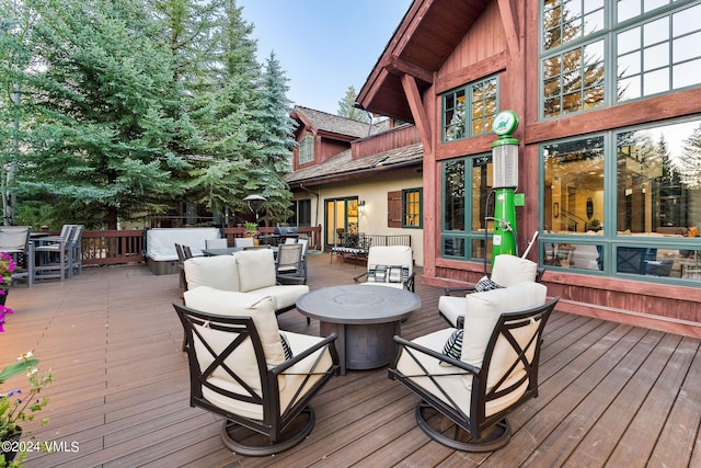 57 Mccoy Creek Dr Unit A, Edwards, CO 81632 - deck with outdoor dining area and an outdoor living space with a fire pit