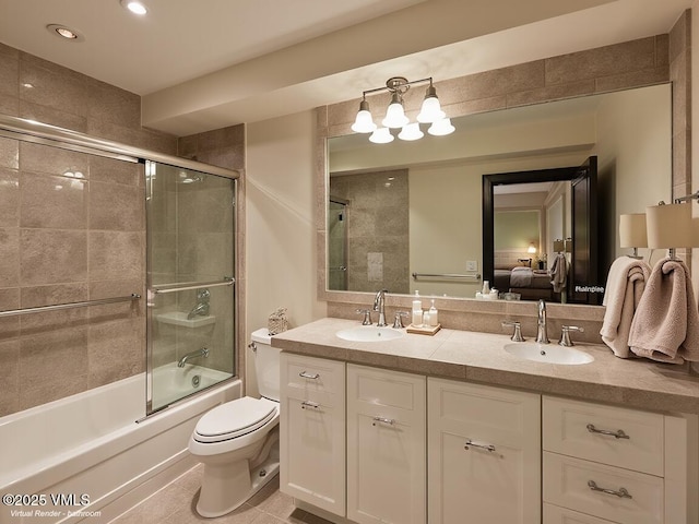 57 Mccoy Creek Dr Unit A, Edwards, CO 81632 - ensuite bathroom featuring double vanity, combined bath / shower with glass door, recessed lighting, and tile patterned flooring