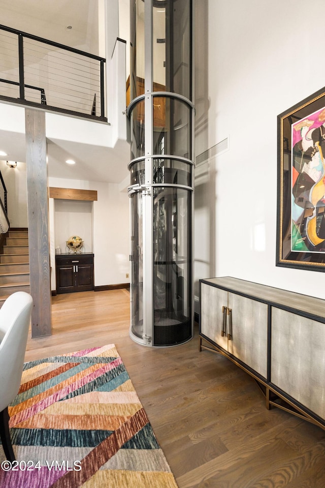 57 Mccoy Creek Dr Unit A, Edwards, CO 81632 - foyer with wood finished floors, a towering ceiling, and stairway