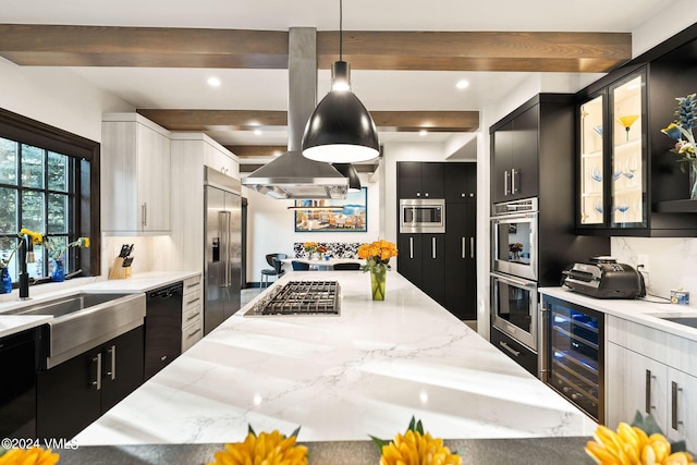 57 Mccoy Creek Dr Unit A, Edwards, CO 81632 - kitchen with wine cooler, built in appliances, beam ceiling, light stone counters, and dark cabinets