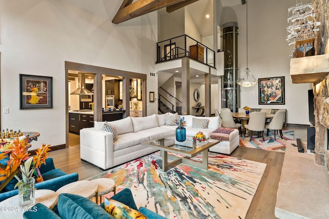 57 Mccoy Creek Dr Unit A, Edwards, CO 81632 - living area with a high ceiling, stairs, and beam ceiling